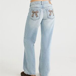 Low rise baggy leopard bow jeans never worn new with tag